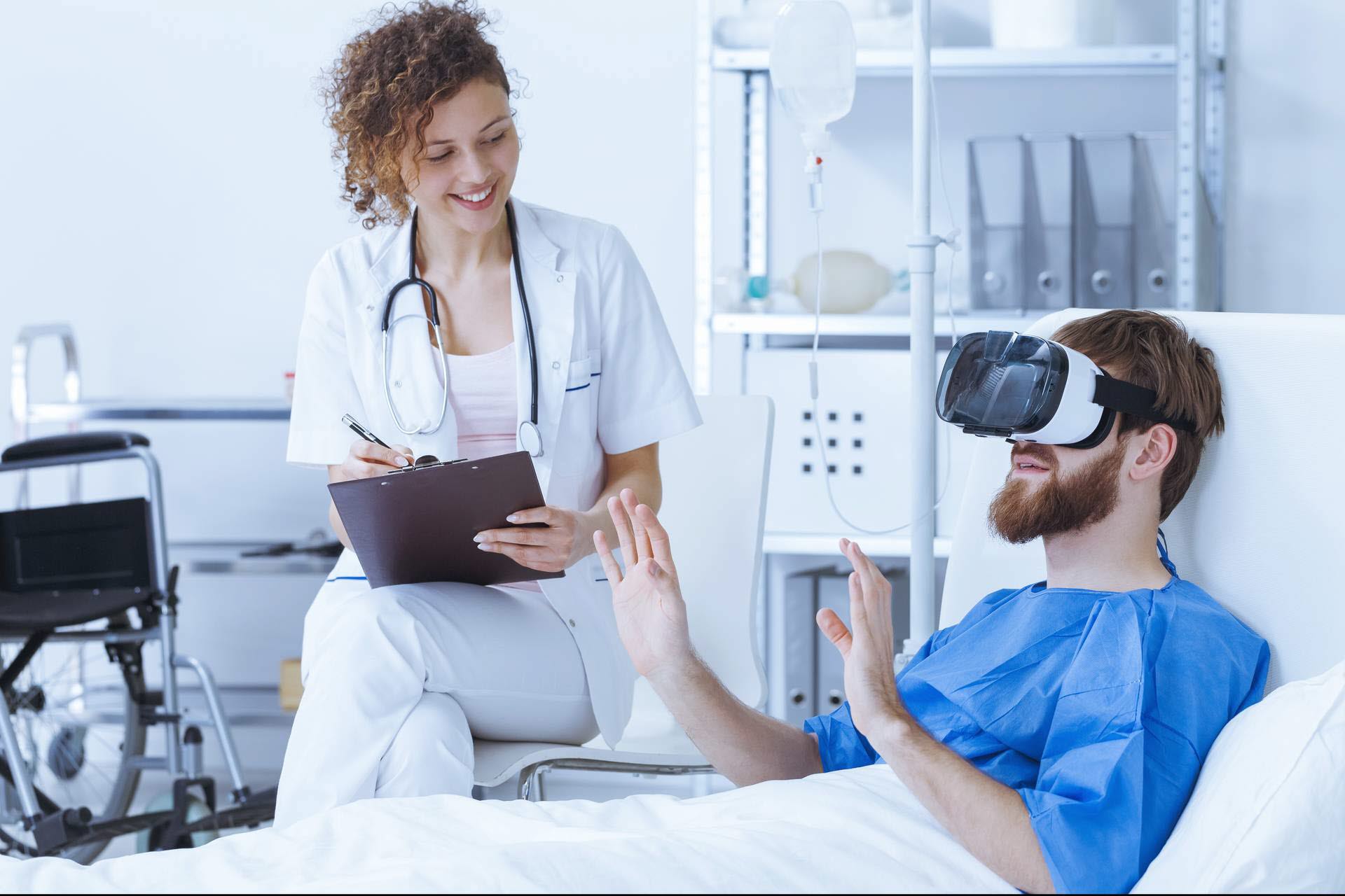 Man wearing a VR headset in a hospital bed 