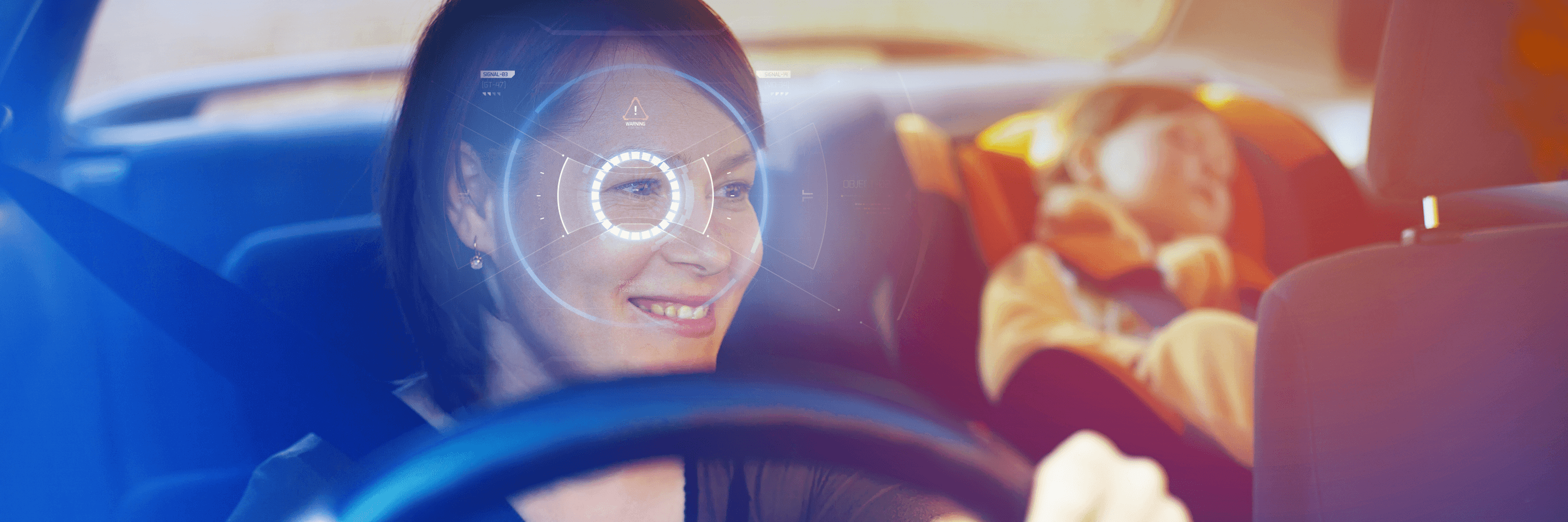 A woman is driving a car