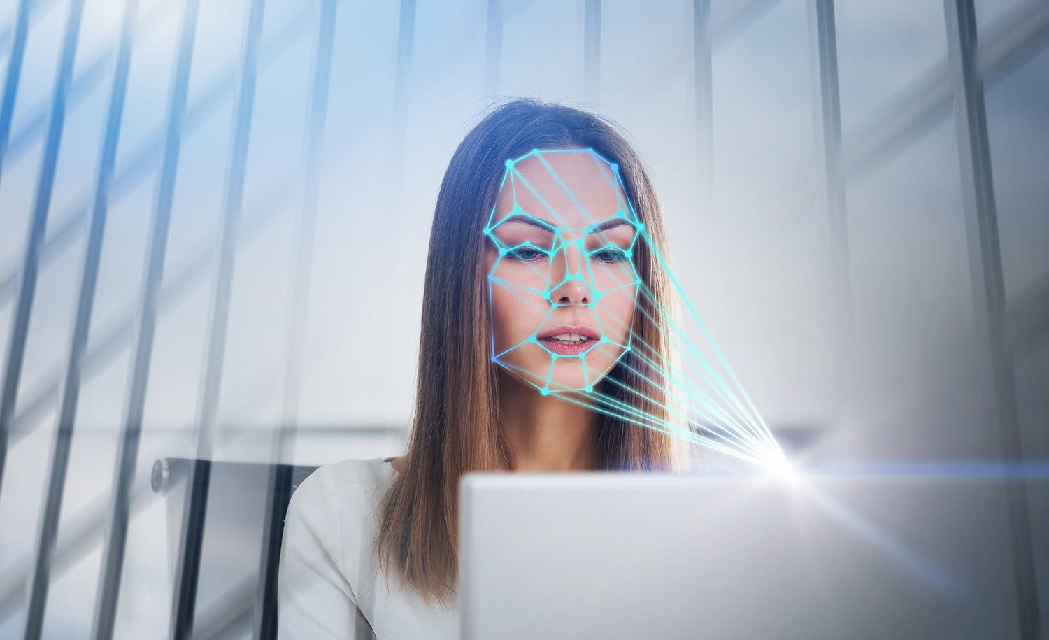 Woman looking at a computer emotion recognition