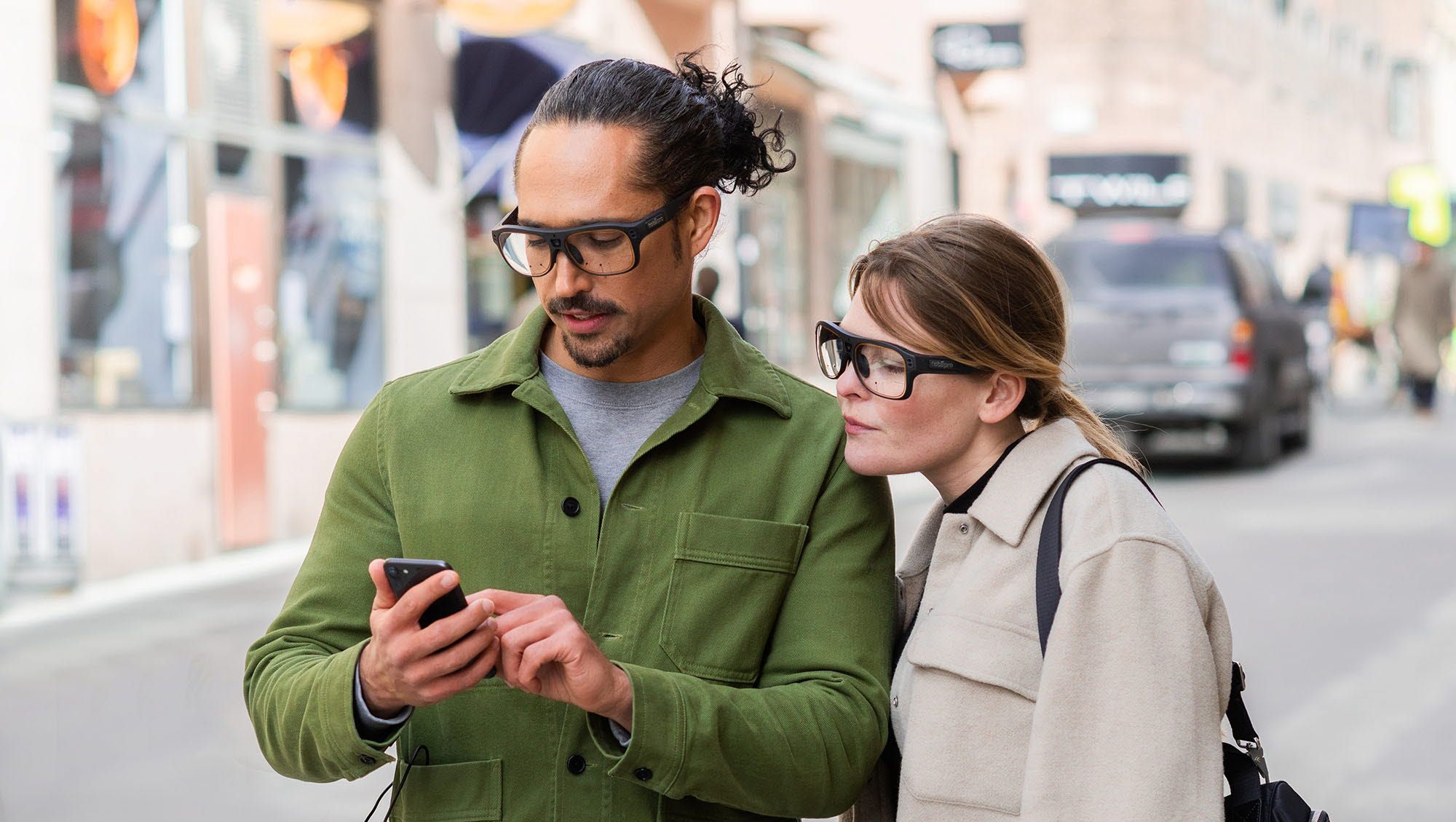 Wearing Tobii Pro Glasses 3 looking at a phone