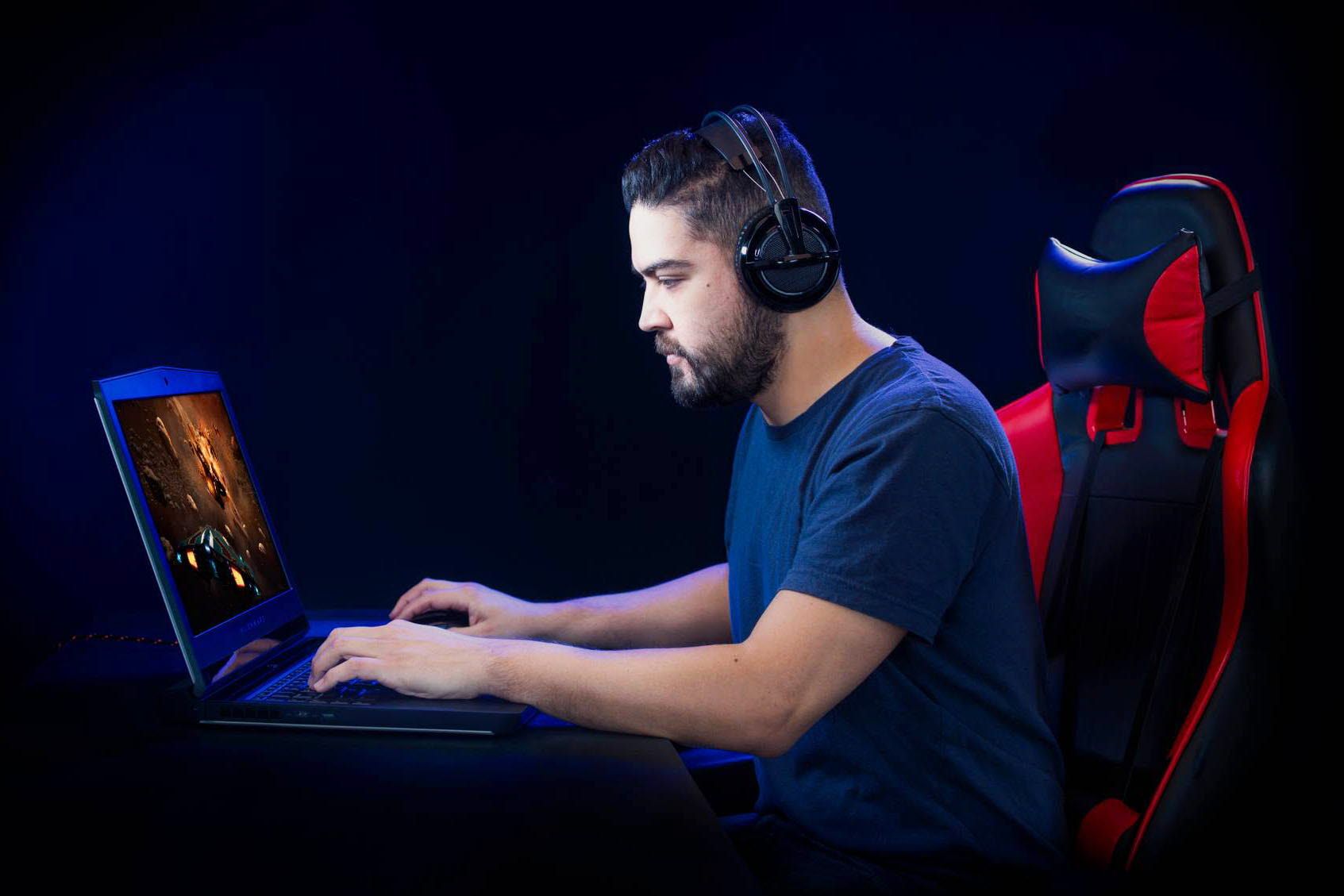 Man gaming at a laptop