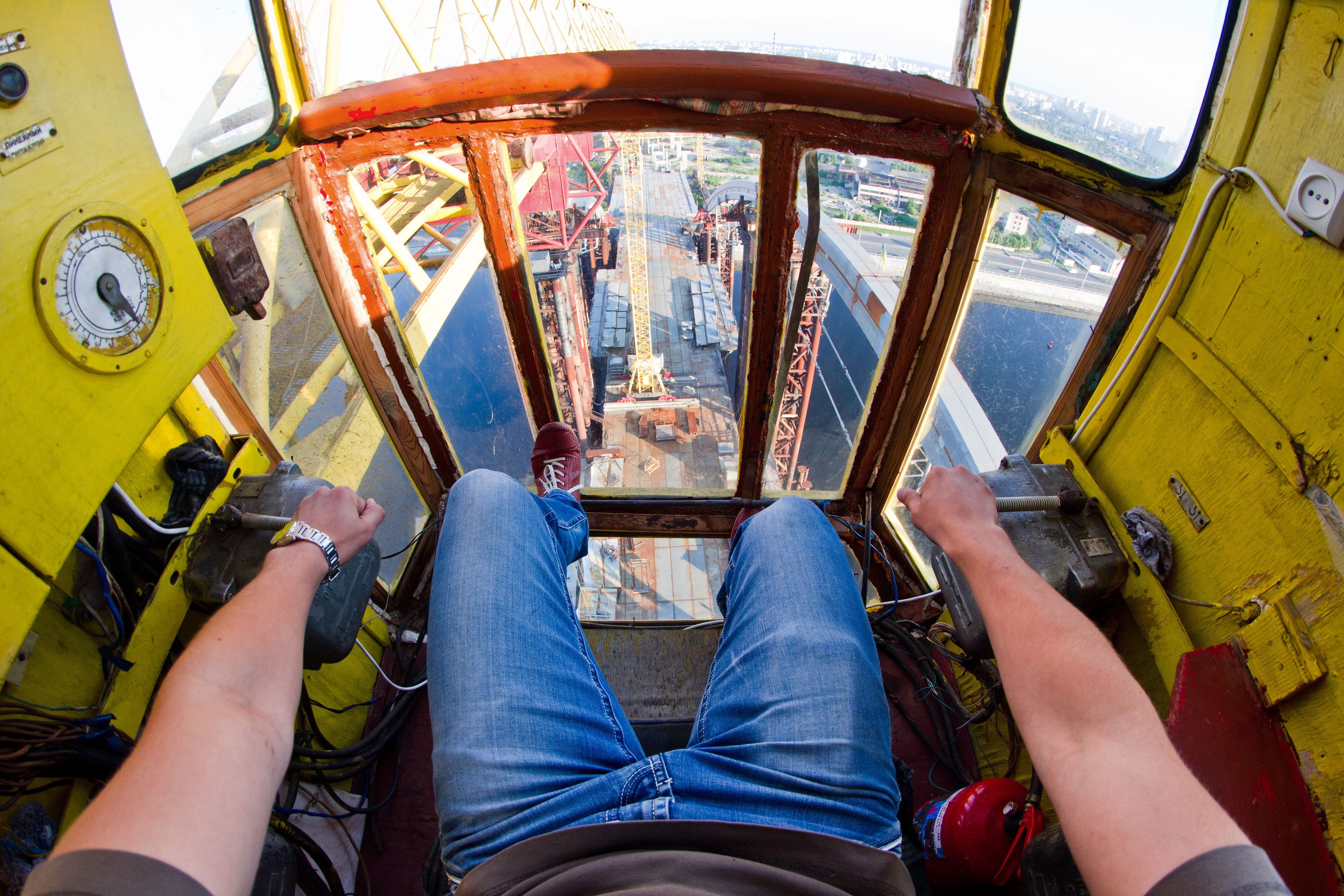 A man driving a gantry crane.