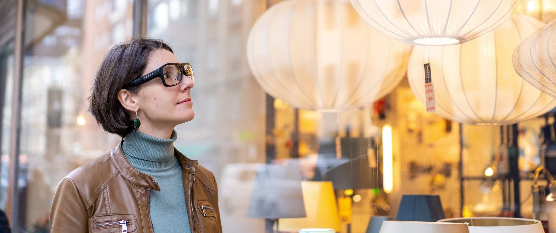 Woman wearing Tobii Pro Glasses 3 window shopping