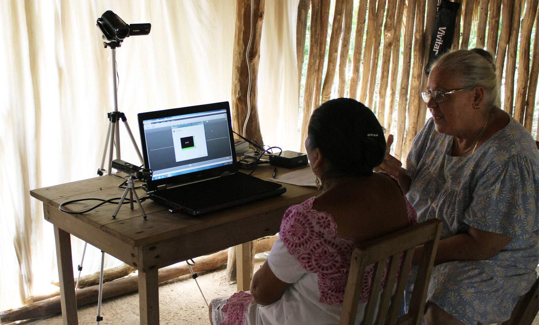 Mayan test participant in front of the Tobii Pro X2-60.
