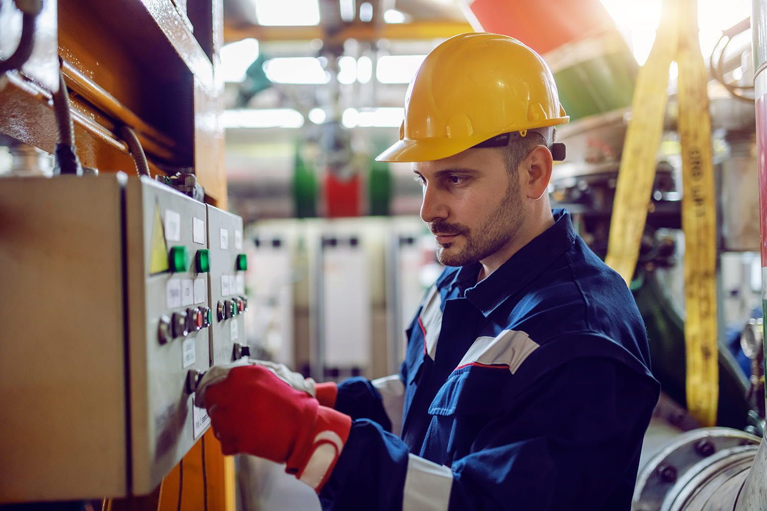 Worker is checking the switchboard.
