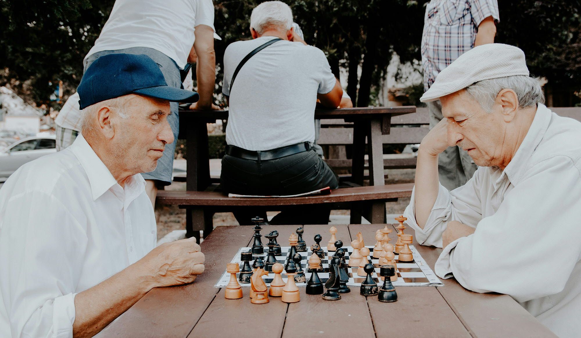 2 older men playing chess