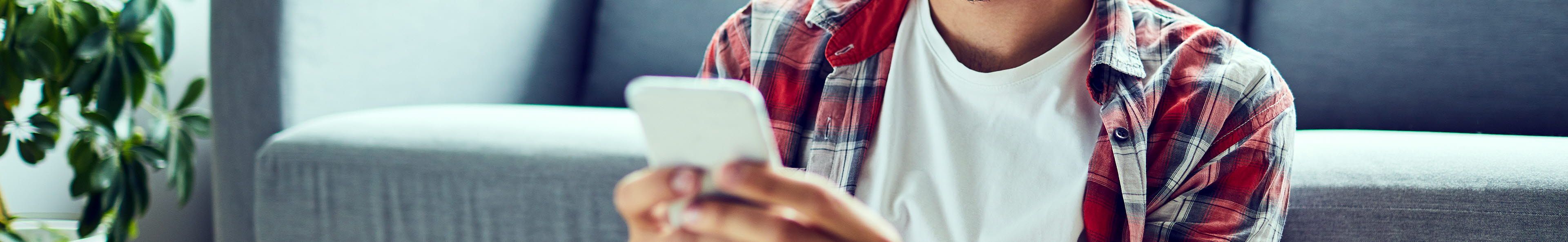 man looking at a mobile