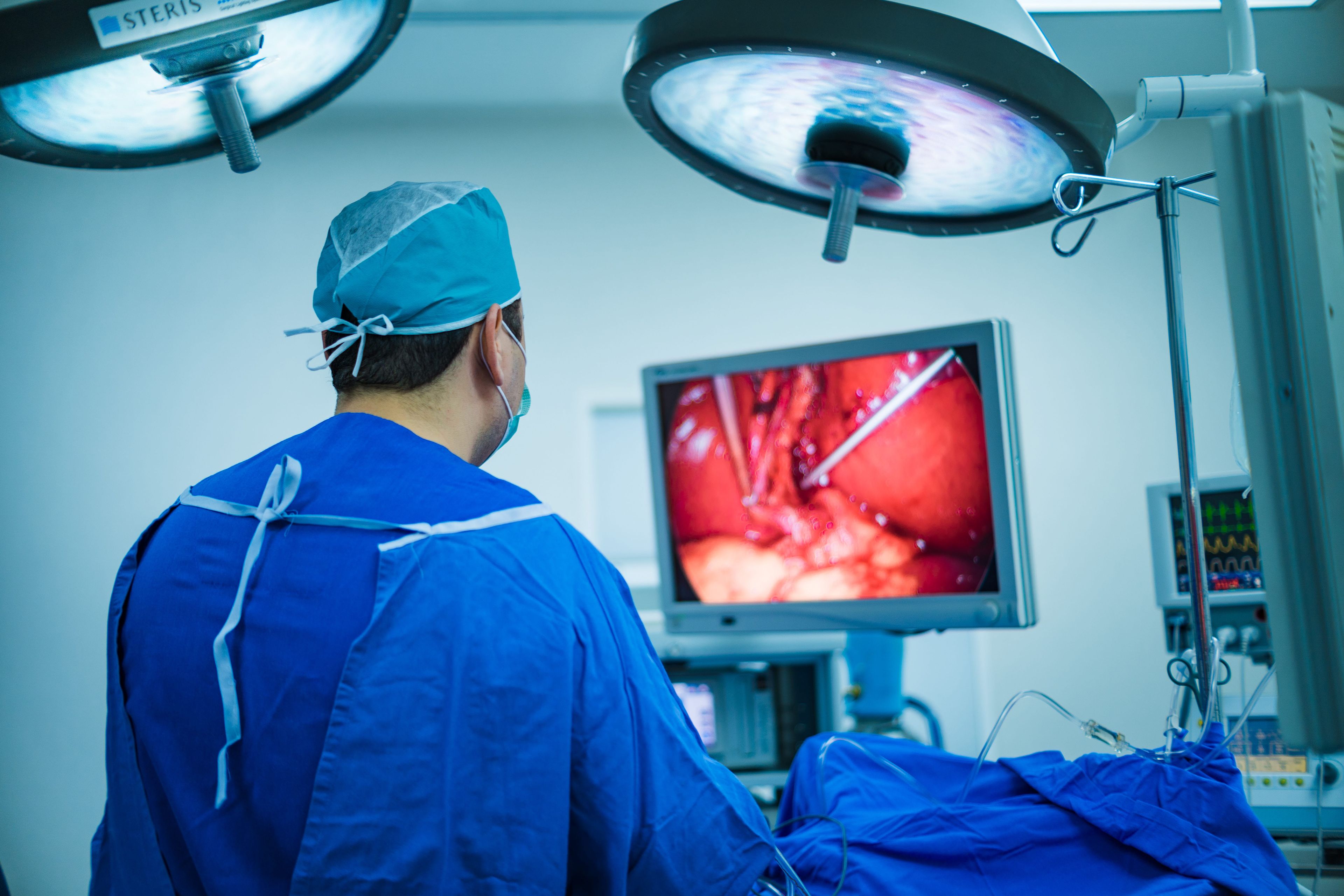 Dr. performing surgery