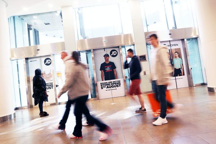 People looking at ads in out-of-home media research 