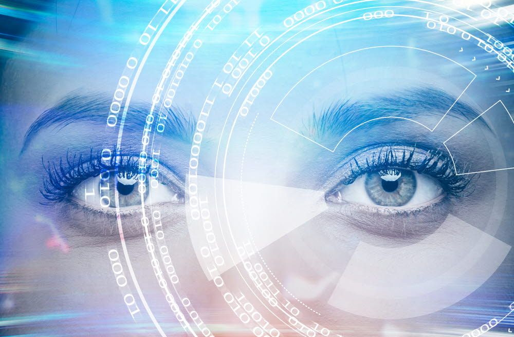 Young attractive woman's face with shining interface hologram