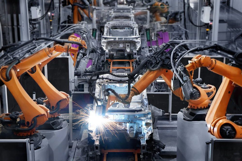Cars are manufactured in automated factories.