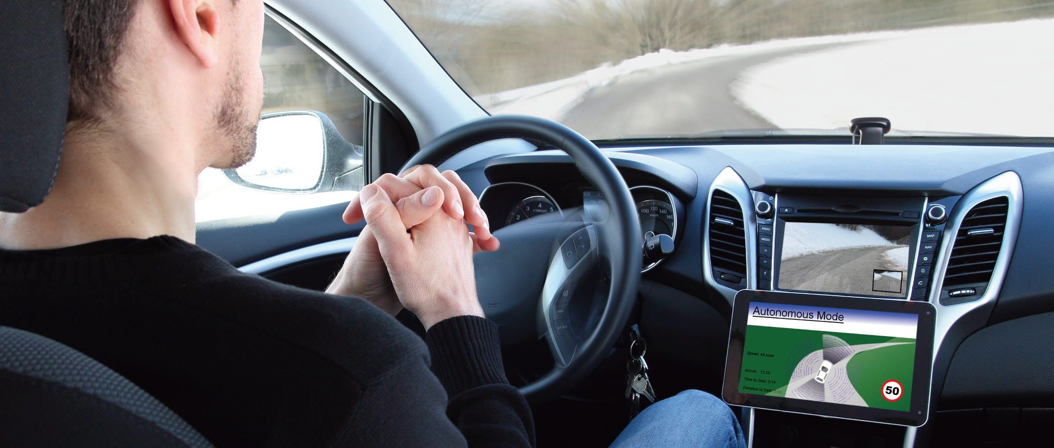 A man is in an automatic car.