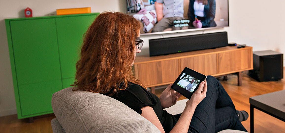 Woman looking at a tablet with wearable eye trackers