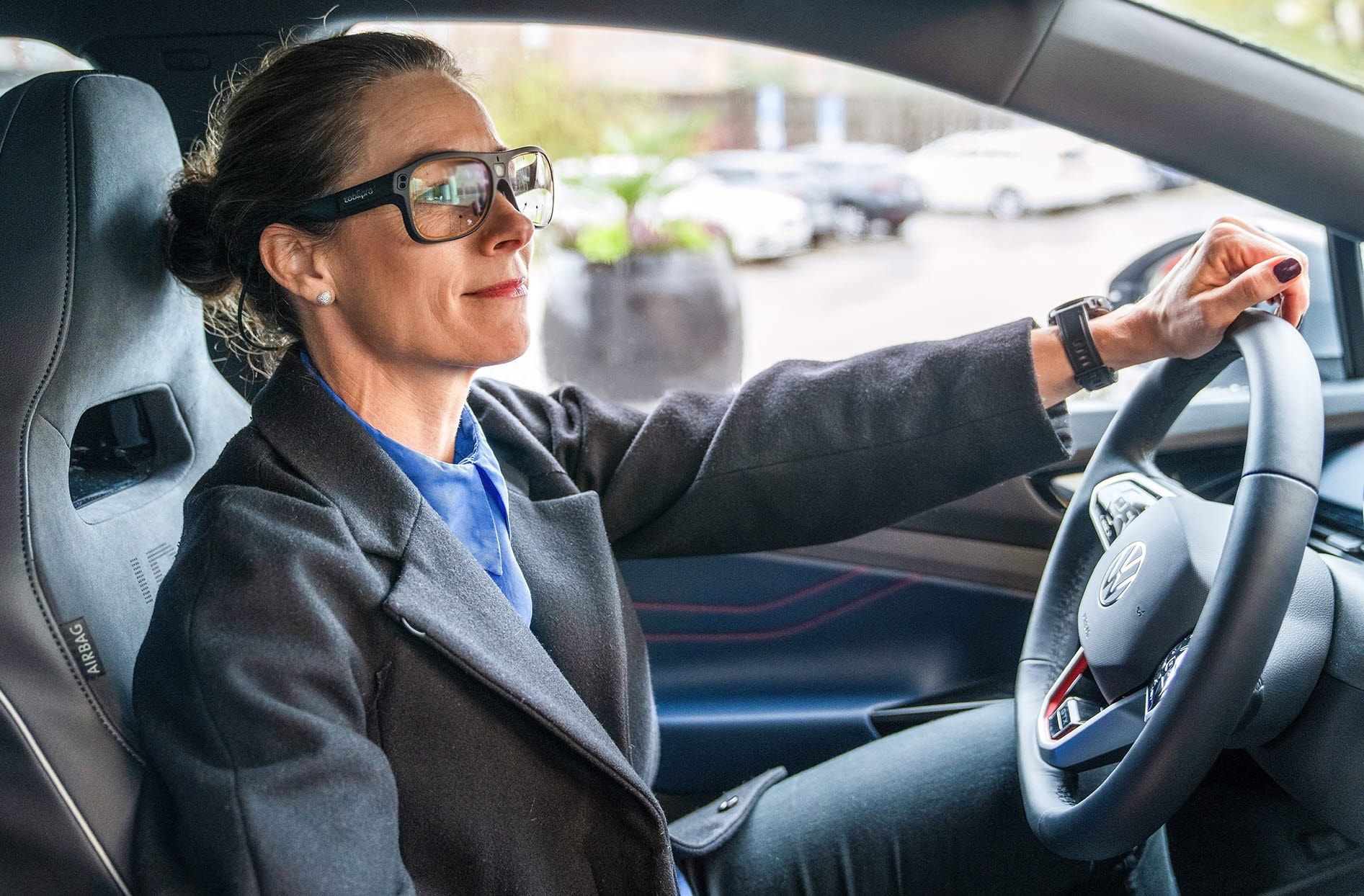 Person driving a car wearing Tobii Pro Glasses 3