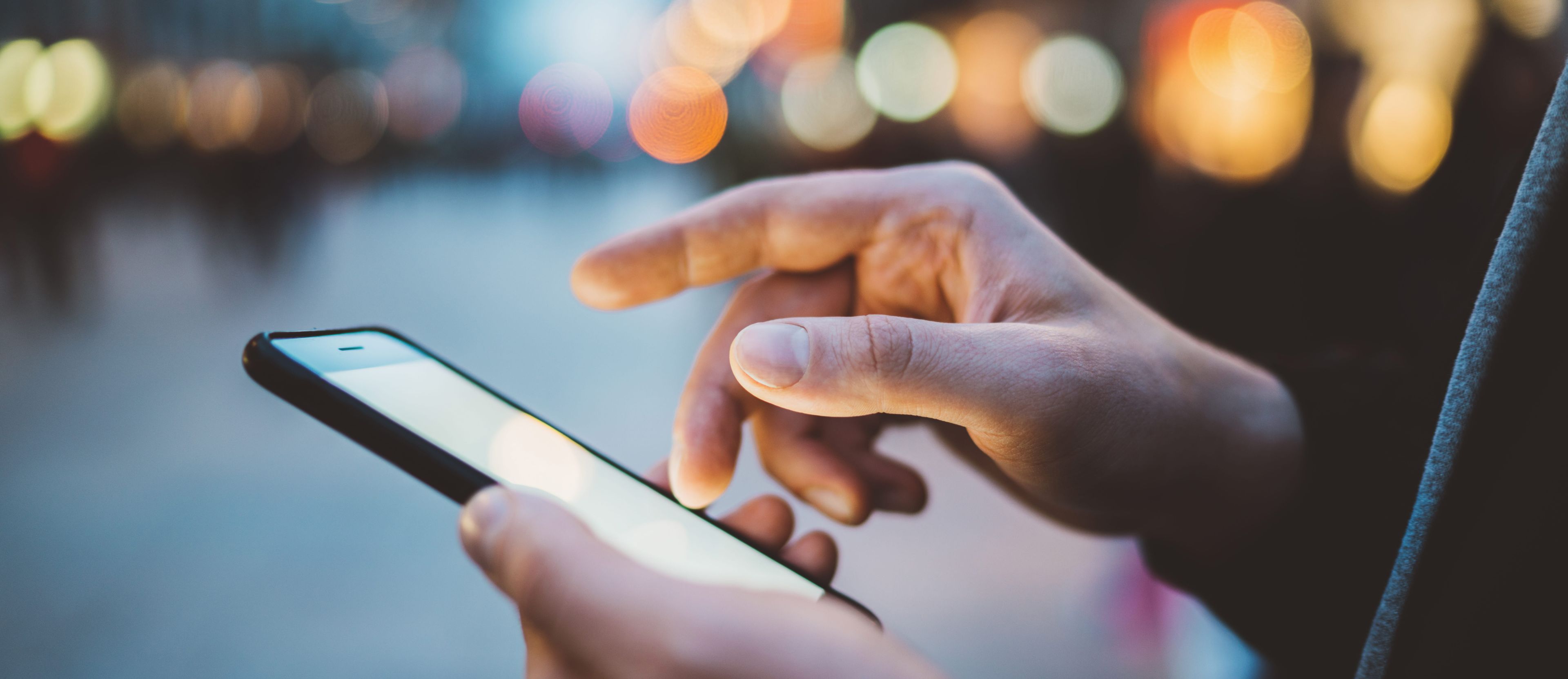 Person lookin at mobile phone