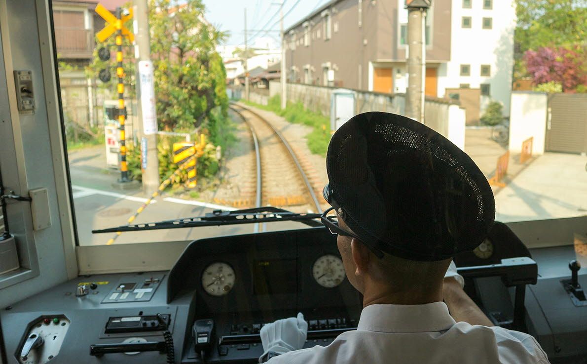 A man is driving a train.