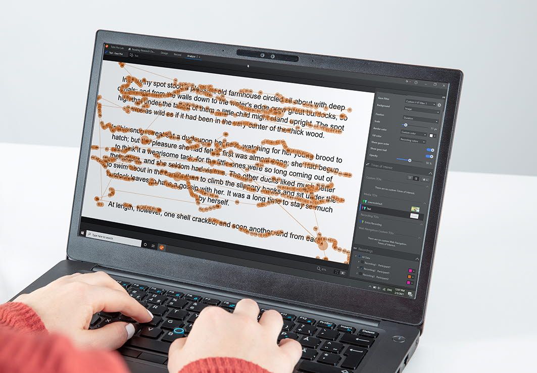 Person reading at a laptop using Tobii Pro Lab software