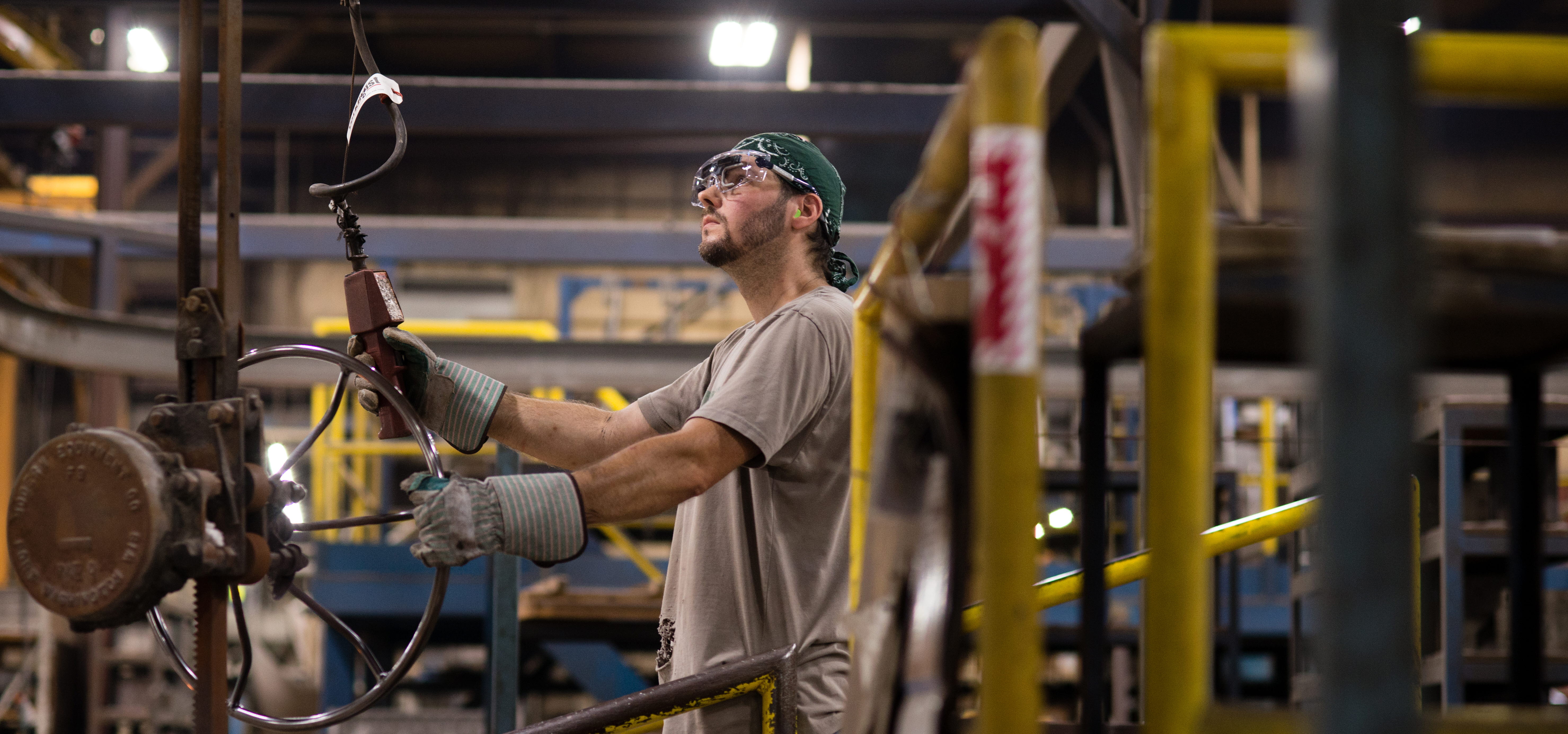 Man using wearable eye trackers in an industrial setting