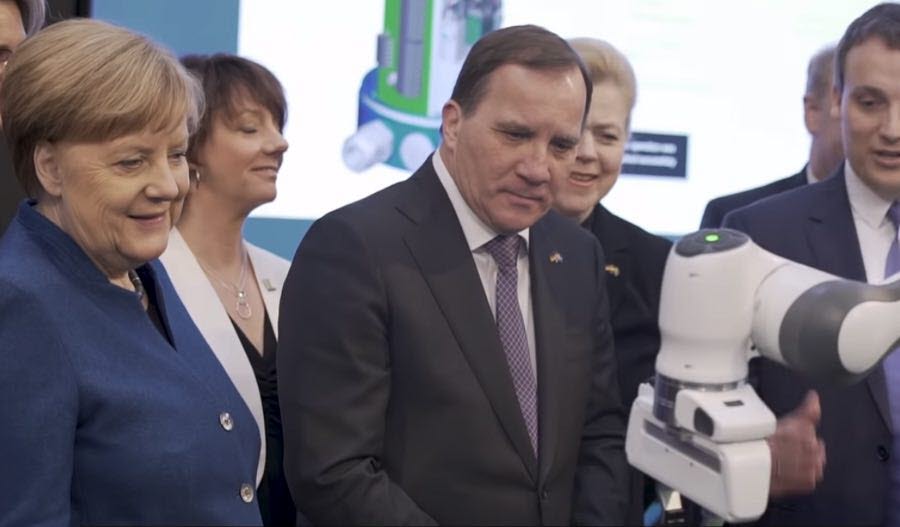 Angela Merkel (Chancellor of Germany) and Sweden's Prime Minister Stefan Löfven looking at eye tracking technologies