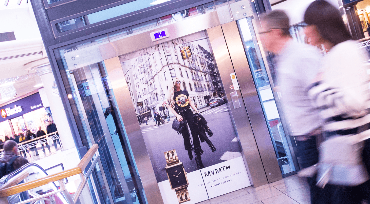 Advertisment displayed on the doors of an elevator in a shopping mall