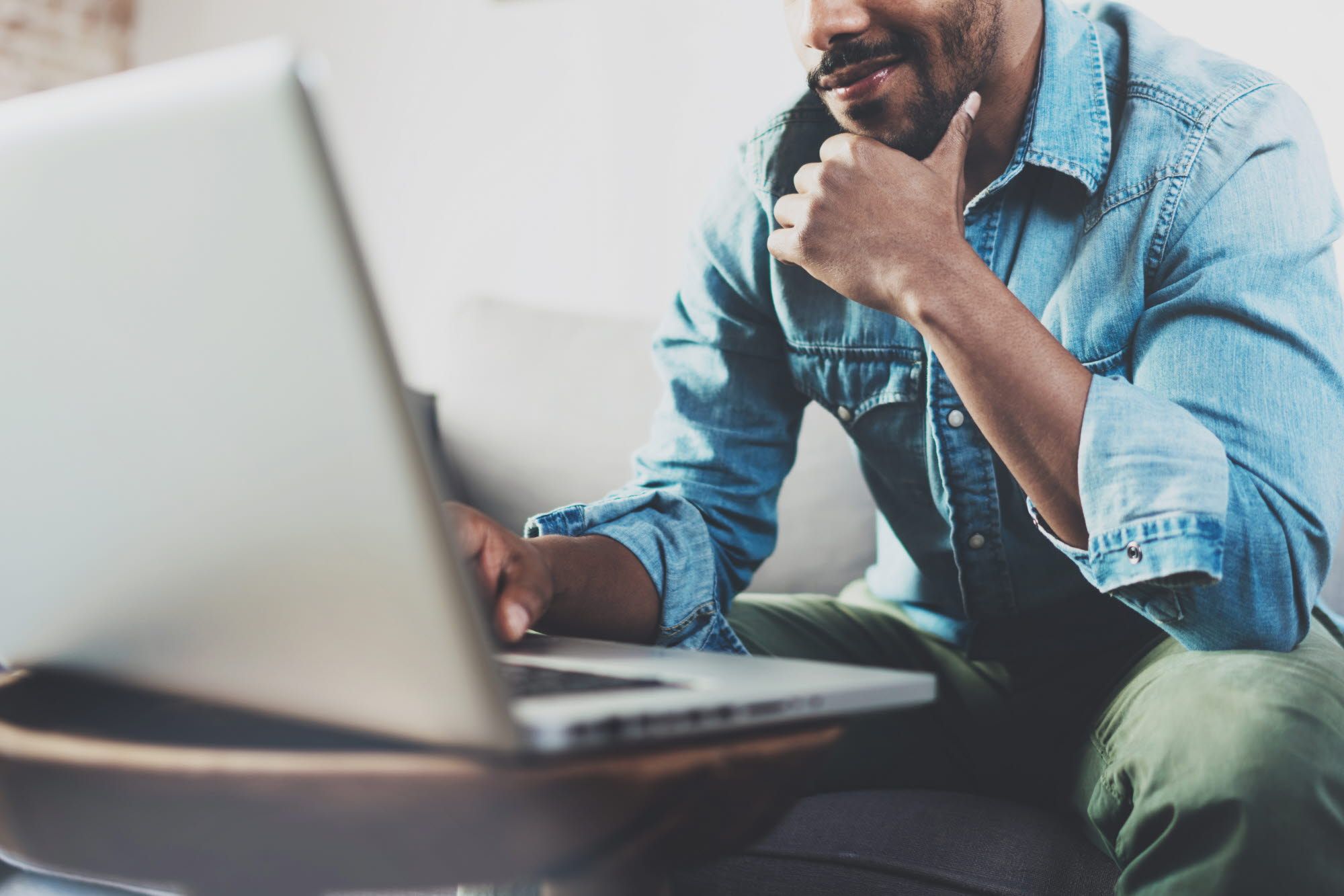 man in front of a laptop