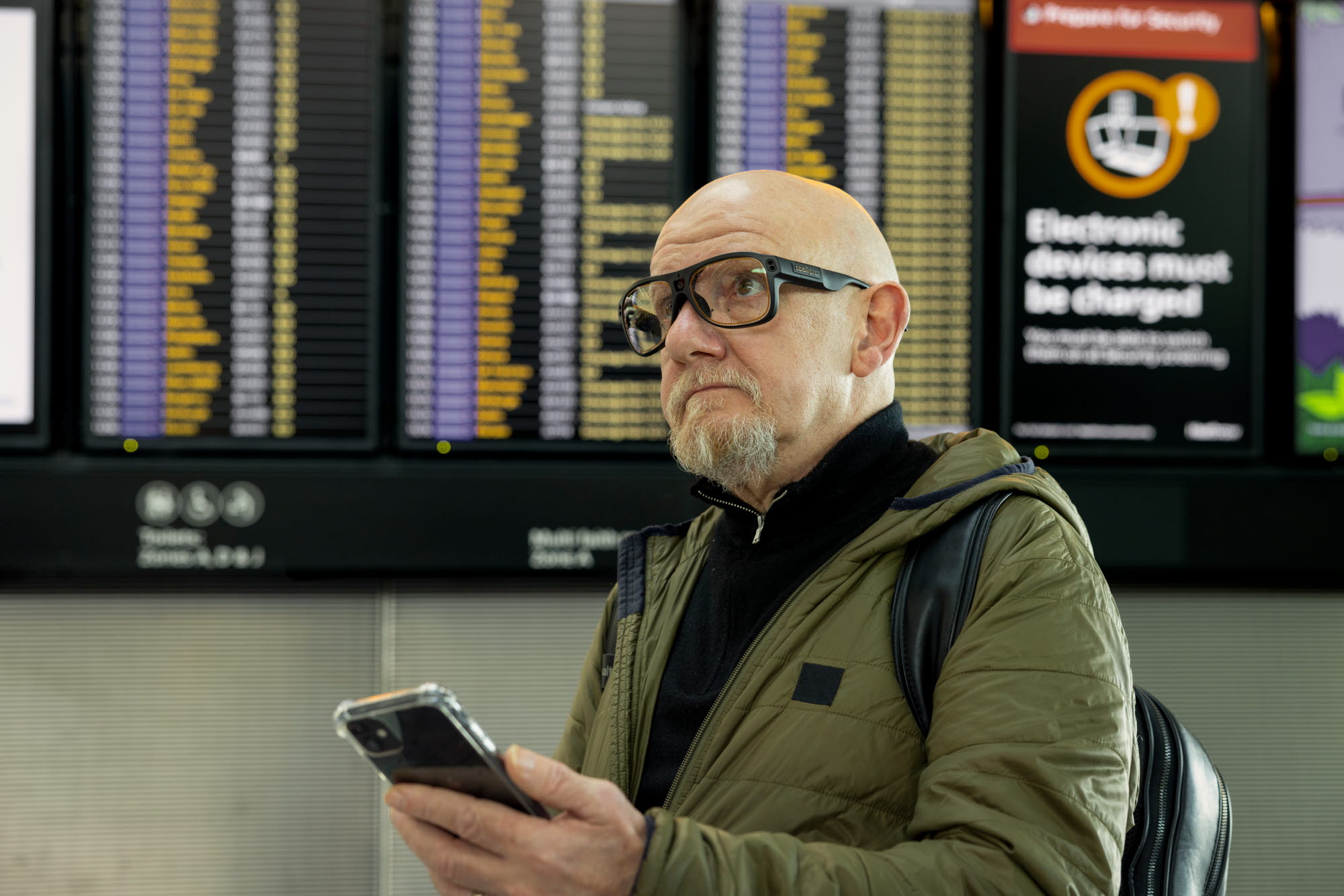 Man at Heathrow airport wearing Tobii Pro Glasses 3
