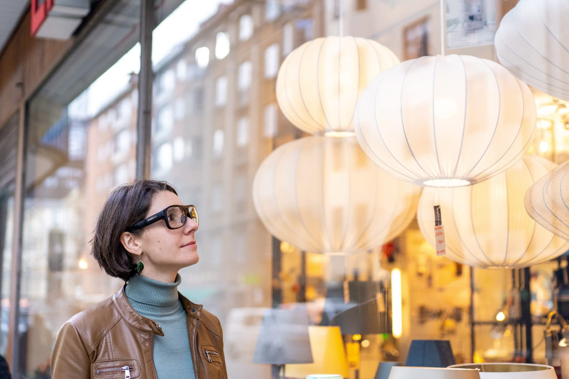 Woman wearing Tobii Pro Glasses 3 window shopping